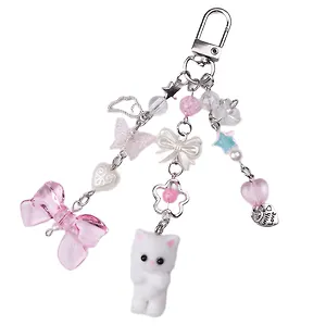 Брелок Котик-пушистик с бантиком и подвесками (ПВХ) (12-04305-202506-cat2)